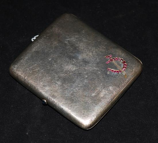 A German? gem set planished 800 standard silver cigarette case with crossed horseshoe and riding crop motif.